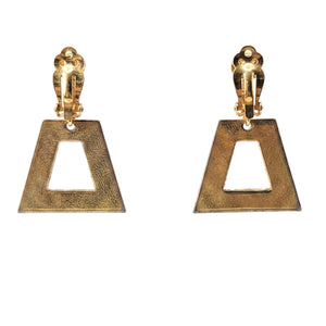 Goldtone clip-on earrings with visible back clip and open triangle cutout