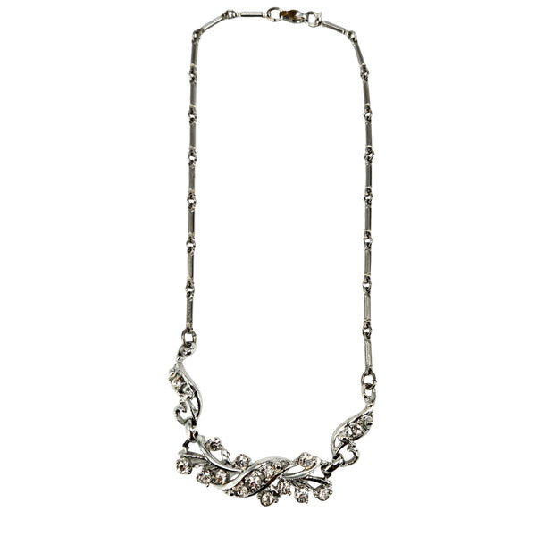 Rhinestone vine collar necklace with silver-tone chain and curved floral center setting.