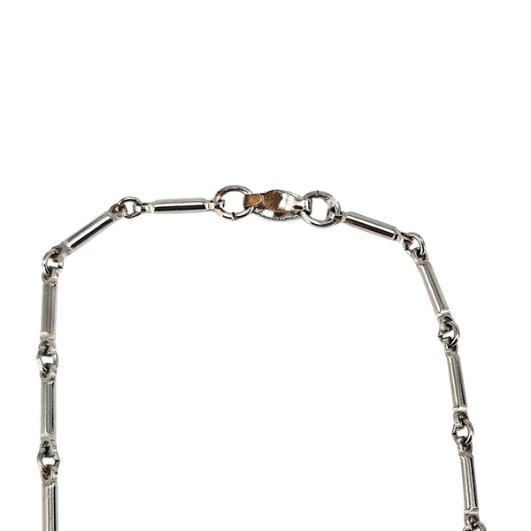 Silver-tone rhodium-plated necklace with chain links and round clasp at top.