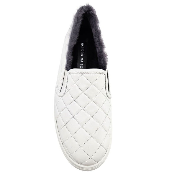 White quilted leather slip-on sneaker with dark shearling lining and open slip entry
