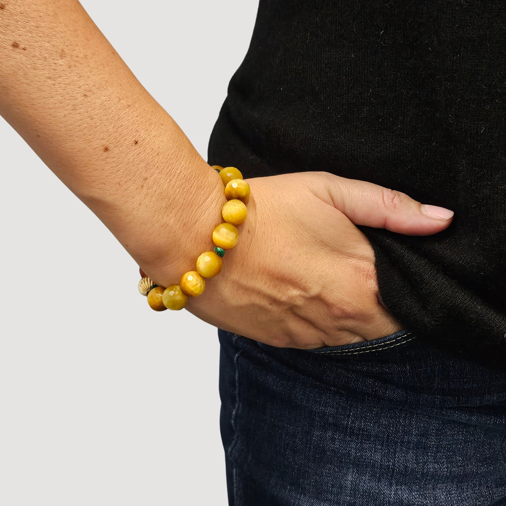 Yellow faceted gemstone stretch bracelet with pearl dangle and dark green accents