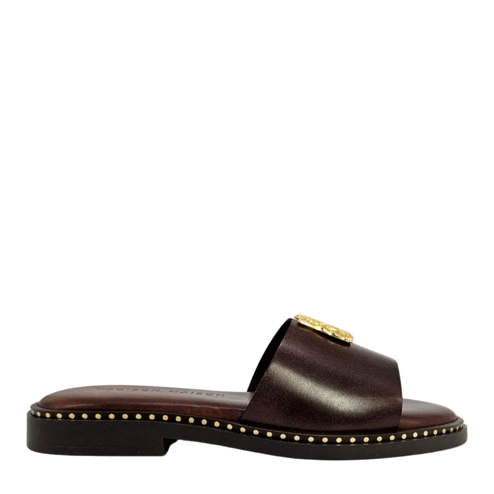 Chocolate-brown leather slide sandal with gold hammered buckle and studded edge