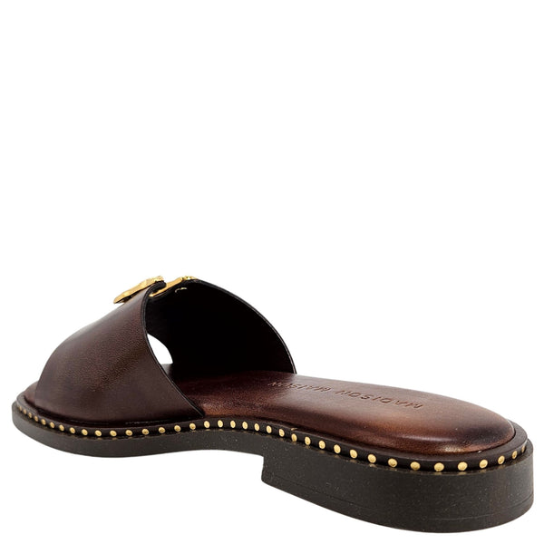 Chocolate-brown leather slide sandal, gold hammered buckle, rounded toe and low heel
