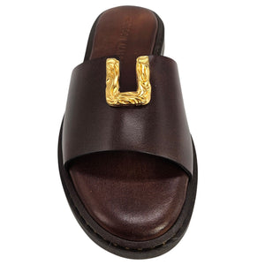 Chocolate-brown leather slide sandal with gold hammered U-shaped buckle