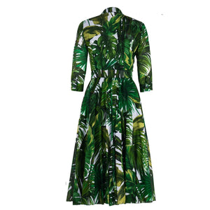 Green palm-print midi dress with collared V-neck, fitted waist, 3/4 sleeves