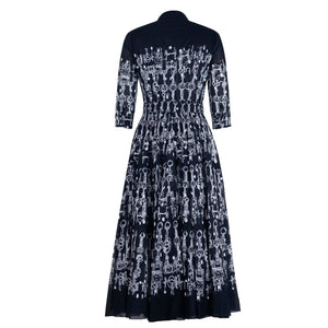Deep indigo horse-chain print long-sleeve midi dress, gathered back yoke, full skirt