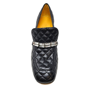 Black quilted loafer with silver buckle strap and textured upper