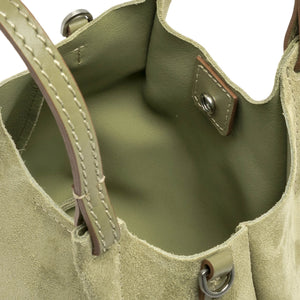 Light green leather mini hobo bag interior with stitched handles and metal hardware