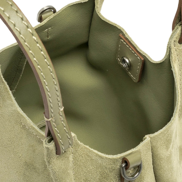Light green leather mini hobo bag interior with stitched handles and metal hardware