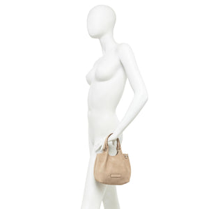 Small leather mini hobo bag shown on mannequin with front logo plaque