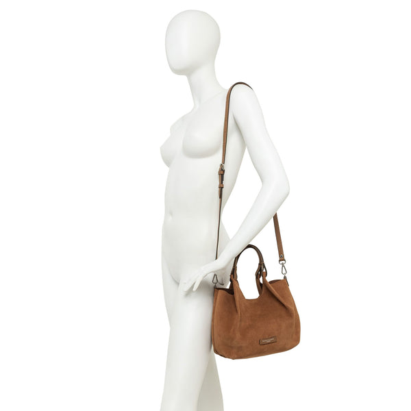 Caramel leather hobo bag on mannequin with crossbody strap and small front logo