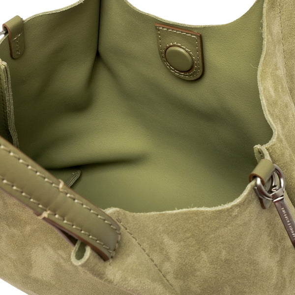 Mini hobo bag interior view with metal snap and smooth suede lining.