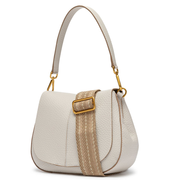 Off-white leather shoulder bag with curved flap, gold buckle detail, and adjustable strap