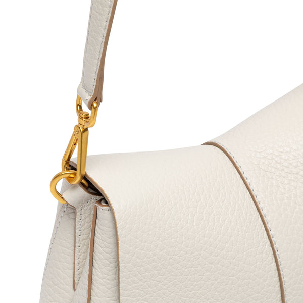 Off-white leather shoulder strap with gold chain hardware and secure attachment at bag