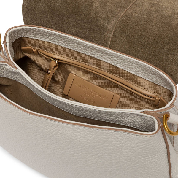 Off-white leather shoulder bag interior view with lined compartments and branded leather patch