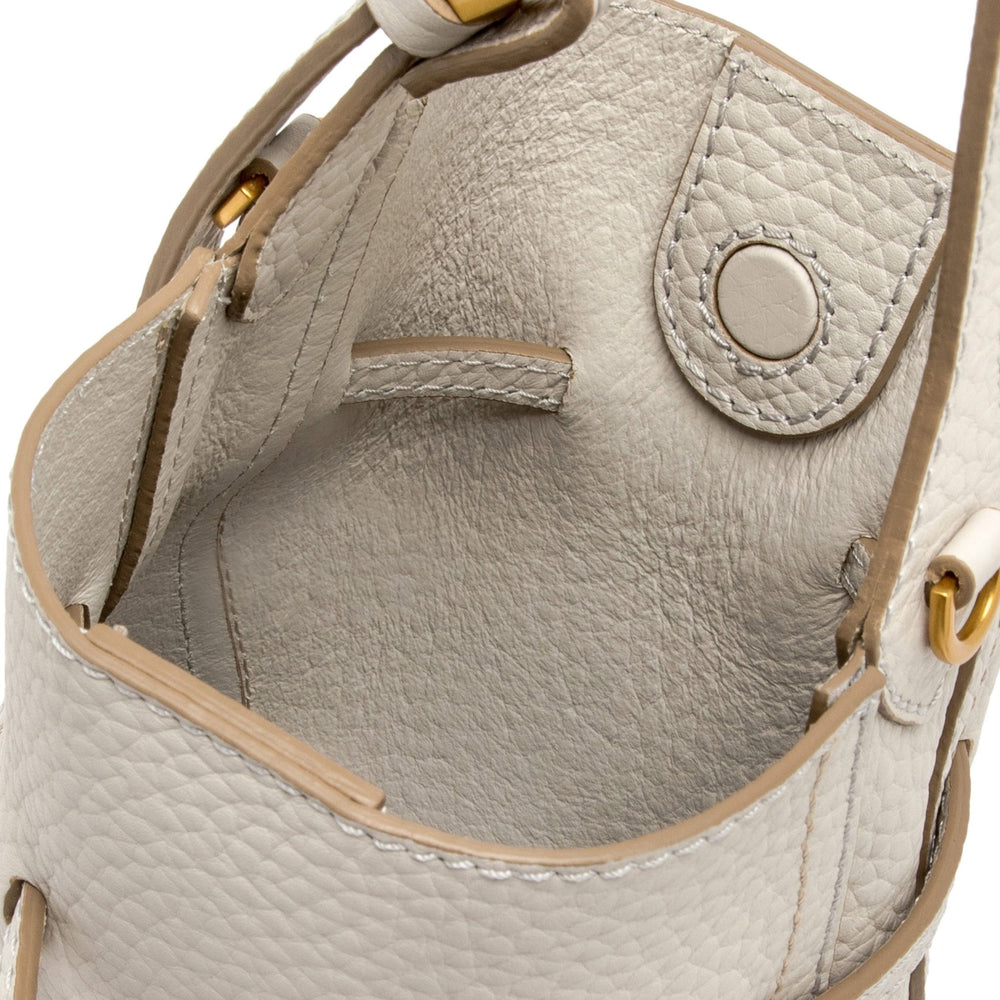 Off-white leather bucket bag with long strap and gold-tone hardware, drawstring closure