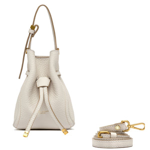 Off-white leather bucket bag with long strap and gold-tone hardware, drawstring closure