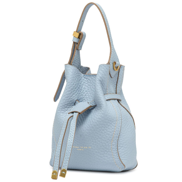 Light blue leather bucket bag with top handle, front tie cords, and gold hardware