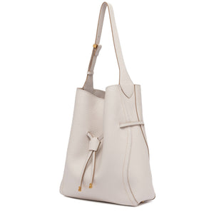 Off-white leather bucket bag with adjustable shoulder strap and front pocket