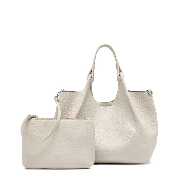 Off white leather hobo bag with top handles and matching zip pouch