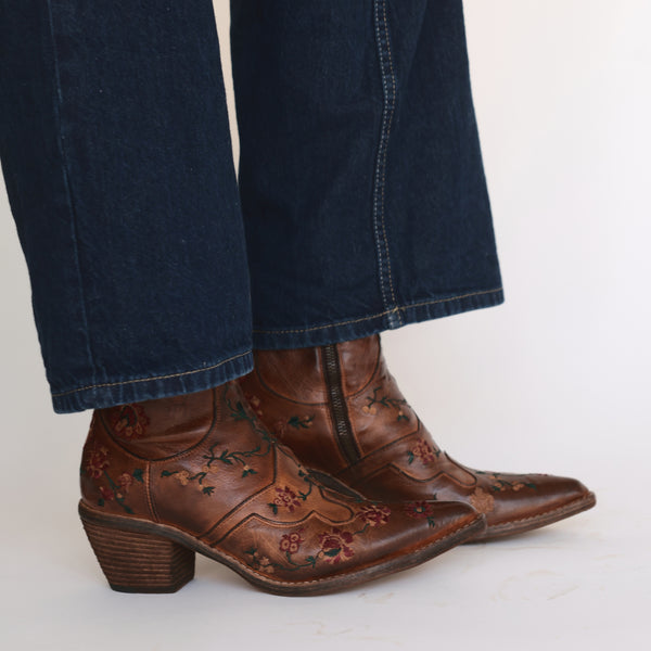 Tan leather ankle boot with floral embroidery and low block heel