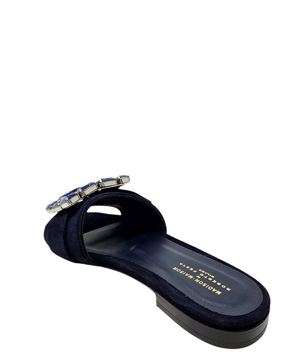 Navy suede slide sandal with blue buckle and cushioned footbed view
