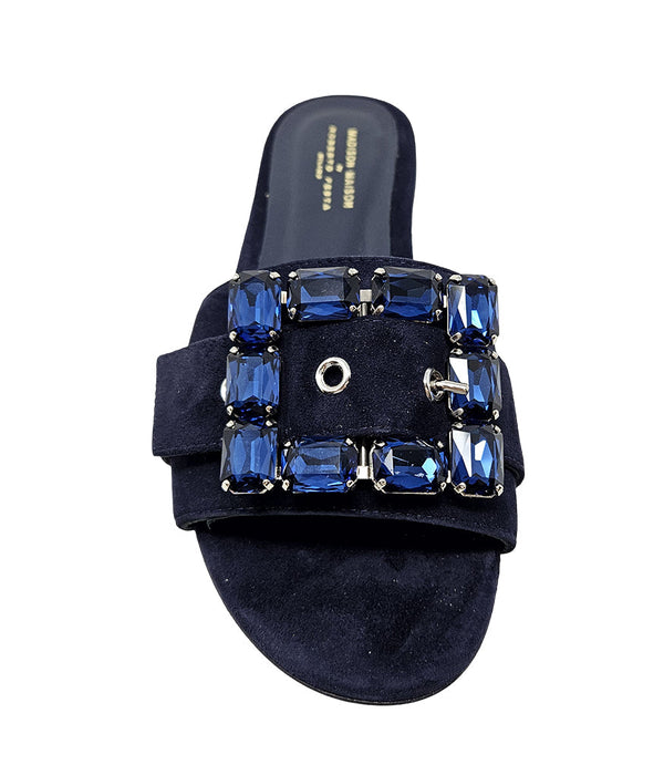Navy suede slide sandal with blue jewel-studded square buckle strap