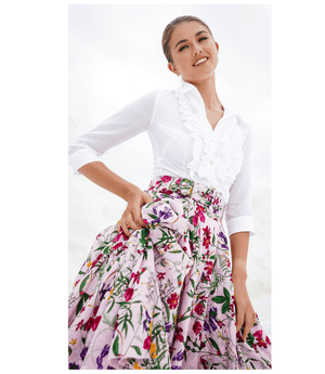 Floral midi skirt with gathered waist and ruffled pleated tiers on light nude