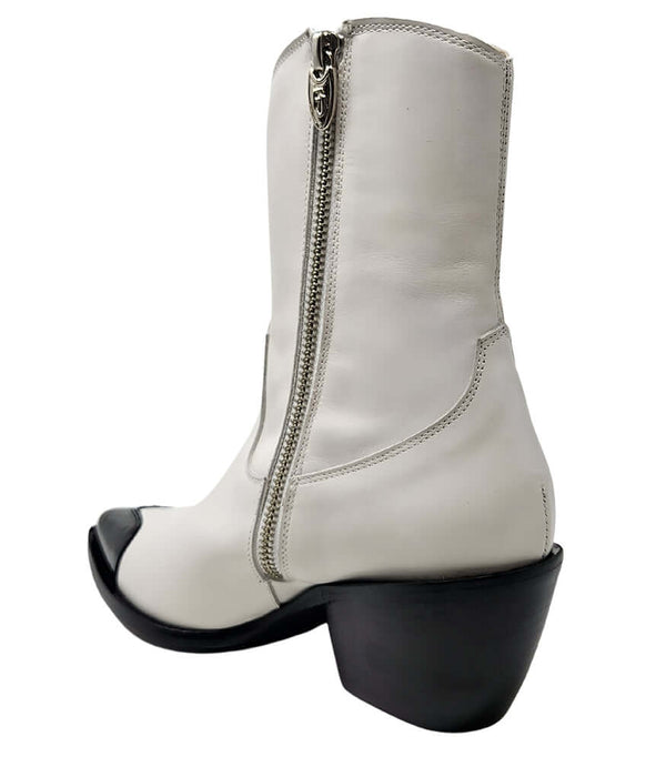 White ankle boot with side zipper and black heart-shaped toe on chunky heel