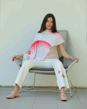 Light wash denim jeans with rose glitter star accents, on-model view