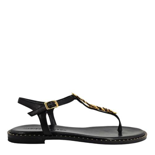 Black flat thong sandal with gold leaf strap detail, buckle, and studded sole