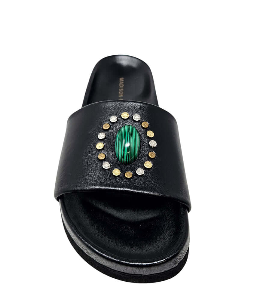 Black open-toe slide sandal with padded footbed and decorative oval gem detail