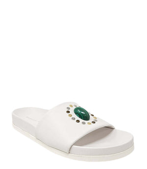 White open-toe slide sandal with green center ornament and textured gold dots