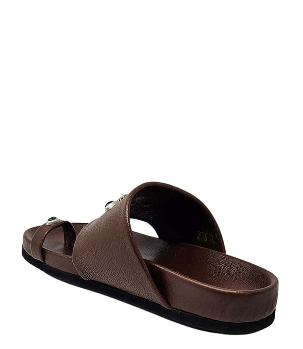 Brown slide sandal with open toe and toe-ring strap with green gem detail