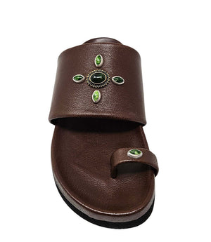 Brown toe-ring sandal with green gem cluster on the upper and toe band