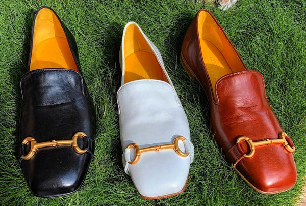 Black leather square-toe loafer with gold-tone bit strap detail