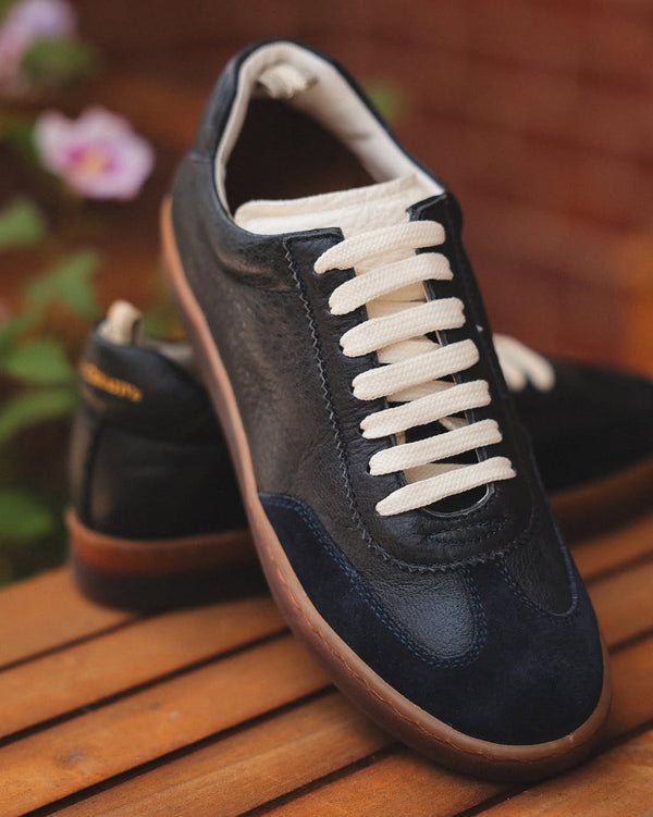 Chance/101 black leather lace-up sneaker with cream laces and gum sole, front side