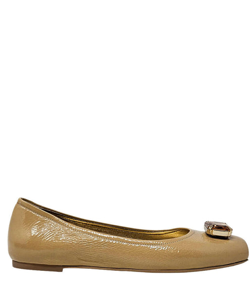 Beige patent ballet flats with rounded toe and jeweled buckle at vamp