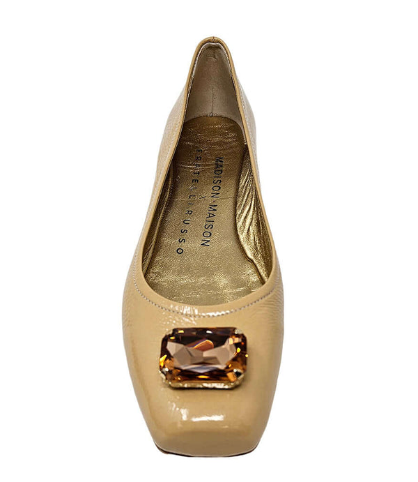 Beige ballet flat with jeweled centerpiece and gold-toned interior label