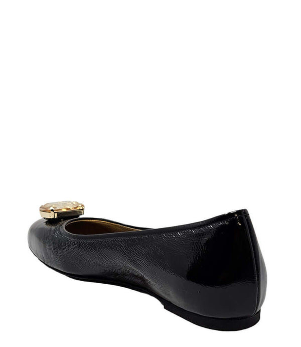 Black jeweled ballet flats, gold gem buckle on top, back view