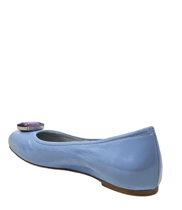 Light blue women's ballet flats, side view, with purple jeweled toe ornament