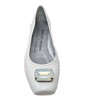 White ballet flat with large jeweled toe embellishment and gray interior