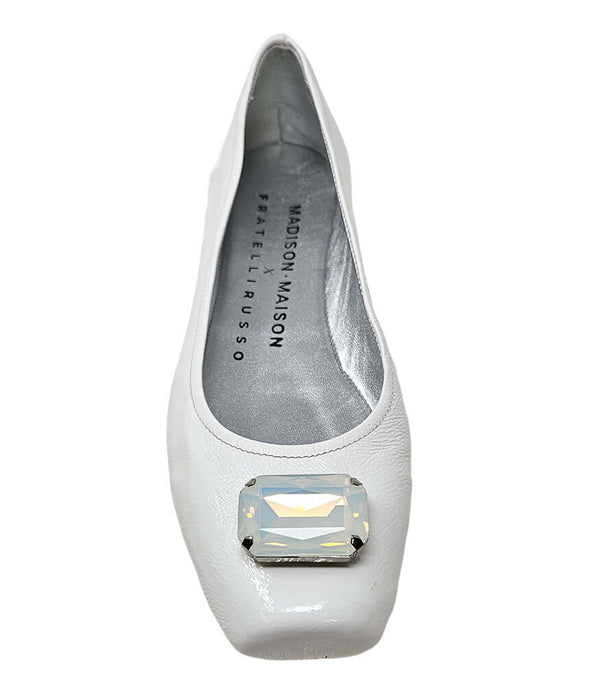 White ballet flat with large jeweled toe embellishment and gray interior