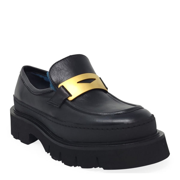 Black platform loafer with gold buckle detail and visible blue shearling lining
