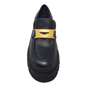 Black leather loafer with gold strap buckle and blue shearling lining