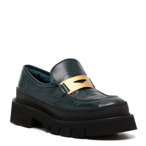 Side view chunky leather loafer with gold buckle strap and shearling-lined collar