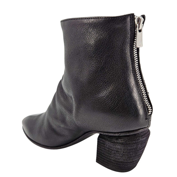 Black leather ankle boot with block heel and side zipper, structured shaft