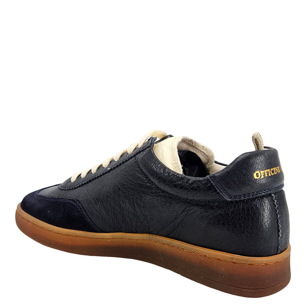 Dark blue leather low-top sneaker with lace-up, off-white heel tab, gum sole