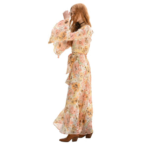 Floral maxi dress with long bell sleeves and tie waist, pale peach base