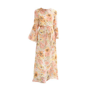 Pale peach floral maxi dress with long bell sleeves and tie waist